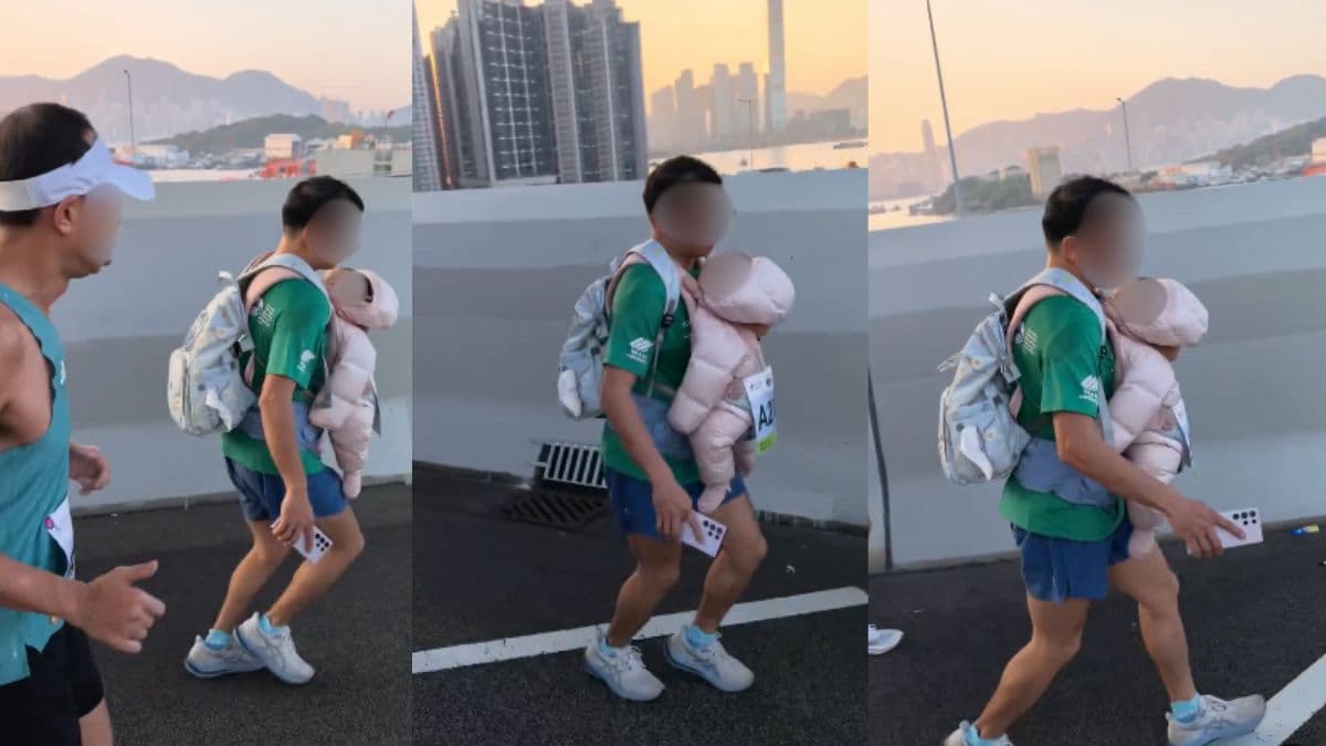 man running carrying baby hk marathon (1).jpg