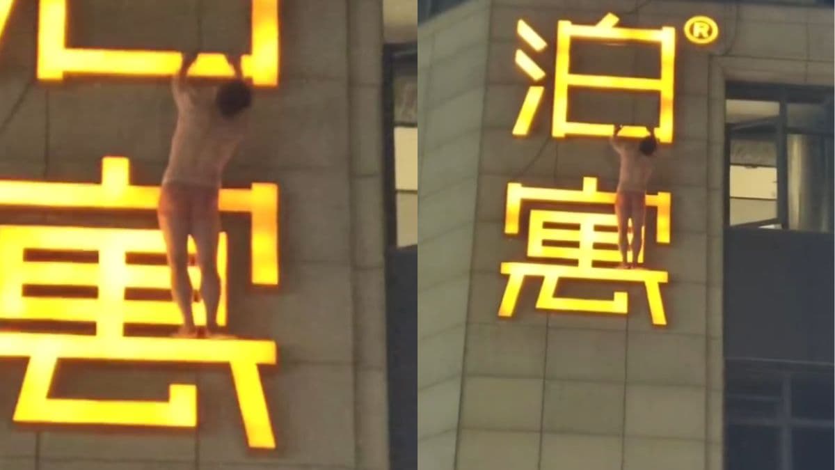 China man in red underwear climbs hotel exterior to escape alleged affair in Hangzhou.jpg